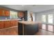 Kitchen with wood cabinets, stainless steel appliances, and island at 3106 E Trapnell Rd, Plant City, FL 33566
