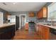 Kitchen with wood cabinets, stainless steel appliances, and island at 3106 E Trapnell Rd, Plant City, FL 33566