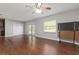 Living room with hardwood floors and sliding glass doors at 3106 E Trapnell Rd, Plant City, FL 33566