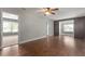 Open living space with hardwood floors and access to other rooms at 3106 E Trapnell Rd, Plant City, FL 33566