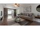 Bright living room with hardwood floors, comfy sofa, and stylish decor at 3106 E Trapnell Rd, Plant City, FL 33566