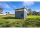 Gray shed in a grassy backyard at 3106 E Trapnell Rd, Plant City, FL 33566