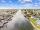 Aerial view of waterfront community with calm waters and boats at 3410 Minnow Creek Dr, Hernando Beach, FL 34607