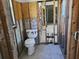 The image shows a bathroom under renovation with a toilet at 3410 Minnow Creek Dr, Hernando Beach, FL 34607