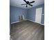 Bedroom with ceiling fan and gray walls at 3703 N 55Th St, Tampa, FL 33619