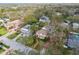 Aerial view of a residential neighborhood showcasing various home styles, mature trees, and well-maintained landscapes at 4611 W Lowell Ave, Tampa, FL 33629