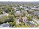 Aerial shot showing the property and the neighborhood, with lush green trees, and various home styles at 4611 W Lowell Ave, Tampa, FL 33629