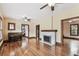 Spacious living room featuring hardwood floors, fireplace, and an open layout with natural light at 4611 W Lowell Ave, Tampa, FL 33629