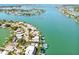 Aerial view of waterfront property with a neighborhood and boats at 518 20Th Ave, Indian Rocks Beach, FL 33785