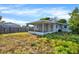 Backyard with screened porch and grassy area at 5418 10Th Ave S, Gulfport, FL 33707