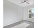 A bright and airy bedroom with a ceiling fan and a large window at 5418 10Th Ave S, Gulfport, FL 33707