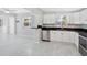 Bright kitchen with white cabinetry, stainless steel dishwasher, and modern fixtures at 5418 10Th Ave S, Gulfport, FL 33707