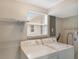 A convenient laundry room with washer, dryer, shelving, and storage options at 5418 10Th Ave S, Gulfport, FL 33707