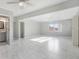 Spacious living room with tile floors, ceiling fans, and lots of natural light at 5418 10Th Ave S, Gulfport, FL 33707