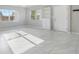 Bright living room with tile floors and built-in shelving at 5418 10Th Ave S, Gulfport, FL 33707
