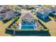 Aerial view showcasing a house with a fenced backyard and pool at 5709 White Trillium Loop, Land O Lakes, FL 34639