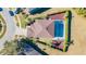 Aerial view of a beautiful home featuring a private pool, landscaped yard and brick driveway at 5709 White Trillium Loop, Land O Lakes, FL 34639