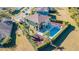 Aerial view showcasing a private backyard oasis with pool, patio area, and fenced yard at 5709 White Trillium Loop, Land O Lakes, FL 34639