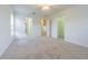 Large bedroom with multiple entryways and neutral carpet, offering a comfortable and versatile space at 5709 White Trillium Loop, Land O Lakes, FL 34639