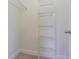 Efficient walk-in closet with wire shelving, providing ample storage space for clothing and accessories at 5709 White Trillium Loop, Land O Lakes, FL 34639