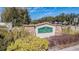 The community sign reads 'Sunset Pointe at Dupree Lakes' and is surrounded by lush, colorful landscaping at 5709 White Trillium Loop, Land O Lakes, FL 34639