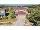 Charming two-story home with landscaped yard, brick driveway, and attached two car garage at 5709 White Trillium Loop, Land O Lakes, FL 34639