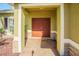 Home front porch with a double door entry and stone accents at 5709 White Trillium Loop, Land O Lakes, FL 34639