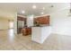 Bright and spacious kitchen with dark cabinets, stainless steel appliances, and tile flooring at 5709 White Trillium Loop, Land O Lakes, FL 34639