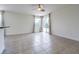 Bright living room features tile floors, recessed lights, and glass doors to backyard at 5709 White Trillium Loop, Land O Lakes, FL 34639