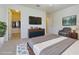 Spacious main bedroom with walk-in closet, TV, and contemporary furnishings at 5709 White Trillium Loop, Land O Lakes, FL 34639