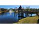 Picturesque pond featuring a gazebo and fountain, adding to the community's charm at 5709 White Trillium Loop, Land O Lakes, FL 34639