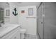 Updated bathroom with vanity, toilet, and shower at 5817 Park N St # 204, St Petersburg, FL 33709