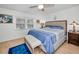 Cozy bedroom with a light wood flooring and ample natural light at 5817 Park N St # 204, St Petersburg, FL 33709