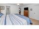 Spacious bedroom featuring a large closet, ceiling fan and warm wood flooring at 5817 Park N St # 204, St Petersburg, FL 33709