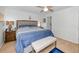 Comfortable bedroom with neutral walls, ceiling fan and access to ensuite bathroom at 5817 Park N St # 204, St Petersburg, FL 33709