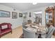 Dining room features a glass-top table and four grey chairs at 5817 Park N St # 204, St Petersburg, FL 33709