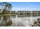 Waterfront condo community featuring lush green spaces and serene lake views at 5817 Park N St # 204, St Petersburg, FL 33709