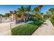 Ground level patio with screen enclosure and lush landscaping at 5817 Park N St # 204, St Petersburg, FL 33709