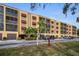 Condo building with parking and landscaping at 5817 Park N St # 204, St Petersburg, FL 33709