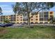 Condo building with parking and landscaping at 5817 Park N St # 204, St Petersburg, FL 33709