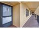 Condo hallway view of front door and exterior windows at 5817 Park N St # 204, St Petersburg, FL 33709