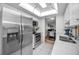 Modern kitchen with stainless steel appliances, quartz countertops, and tile flooring at 5817 Park N St # 204, St Petersburg, FL 33709