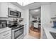 Modern kitchen with stainless steel appliances and white cabinets at 5817 Park N St # 204, St Petersburg, FL 33709