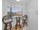 Cozy kitchen nook with glass-top table and wicker chairs at 5817 Park N St # 204, St Petersburg, FL 33709