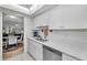 Modern kitchen with white cabinets, stainless steel appliances, and quartz countertops at 5817 Park N St # 204, St Petersburg, FL 33709
