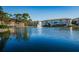 Lakefront property featuring a scenic view of the water and surrounding buildings at 5817 Park N St # 204, St Petersburg, FL 33709
