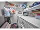 Organized laundry room with modern appliances and plenty of storage space at 5817 Park N St # 204, St Petersburg, FL 33709