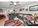 Spacious living room with sectional sofa and access to balcony at 5817 Park N St # 204, St Petersburg, FL 33709