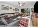 Living room with cozy seating and a sliding glass door leading to the screened porch at 5817 Park N St # 204, St Petersburg, FL 33709