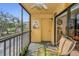 Relaxing screened balcony overlooking lush landscaping and a tranquil lake at 5817 Park N St # 204, St Petersburg, FL 33709
